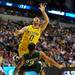 Michigan senior Zack Novak is called for a charge on this play against  Ohio University junior Walter Offutt in the second half of the second round of the NCAA tournament at Bridgestone Arena in Nashville, Tenn.  Melanie Maxwell I AnnArbor.com